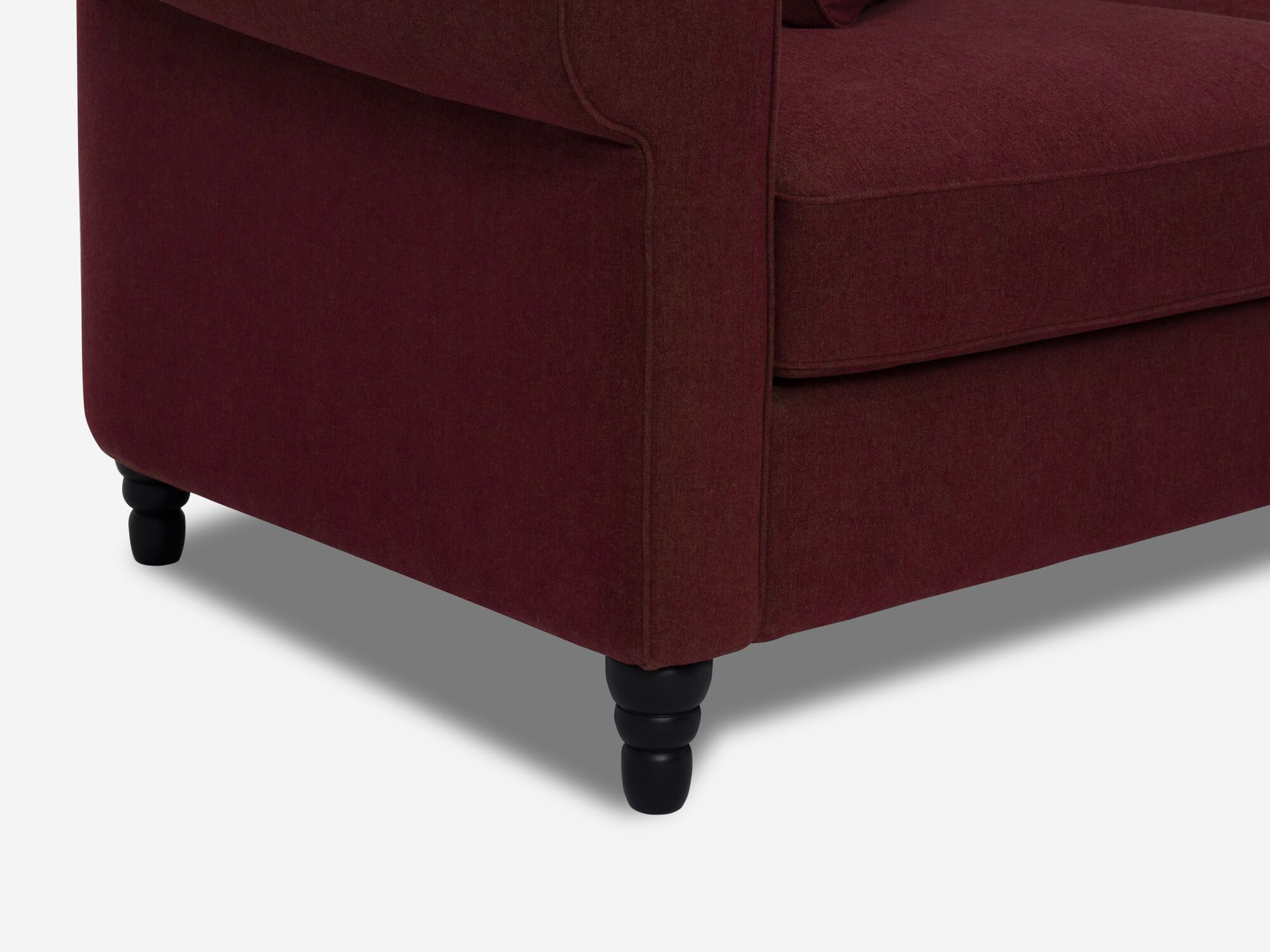 Leg detail view of deep red modern sectional sofa